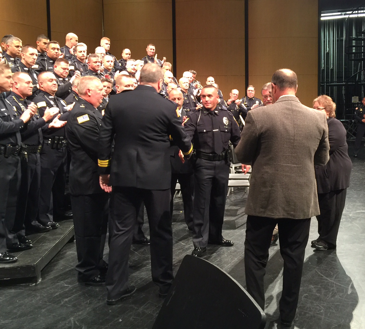Hobart Police Chief shaking hands with newest addition to the Department.    